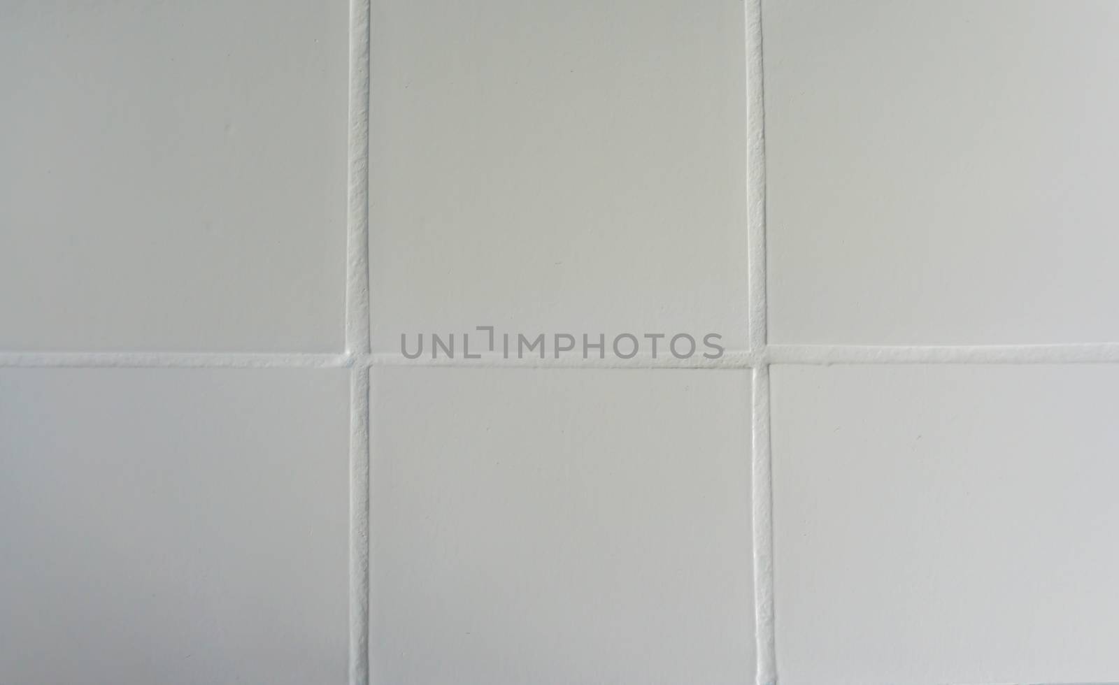 Pure white painted tiling pattern close up macro background