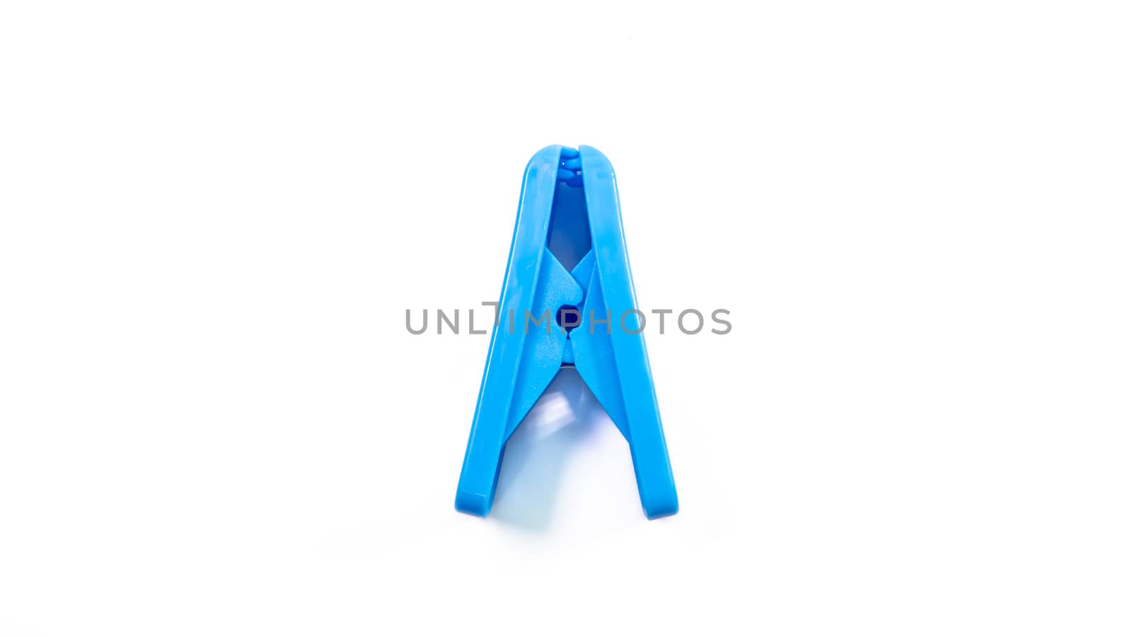 The close up of blue clothes peg on white background.