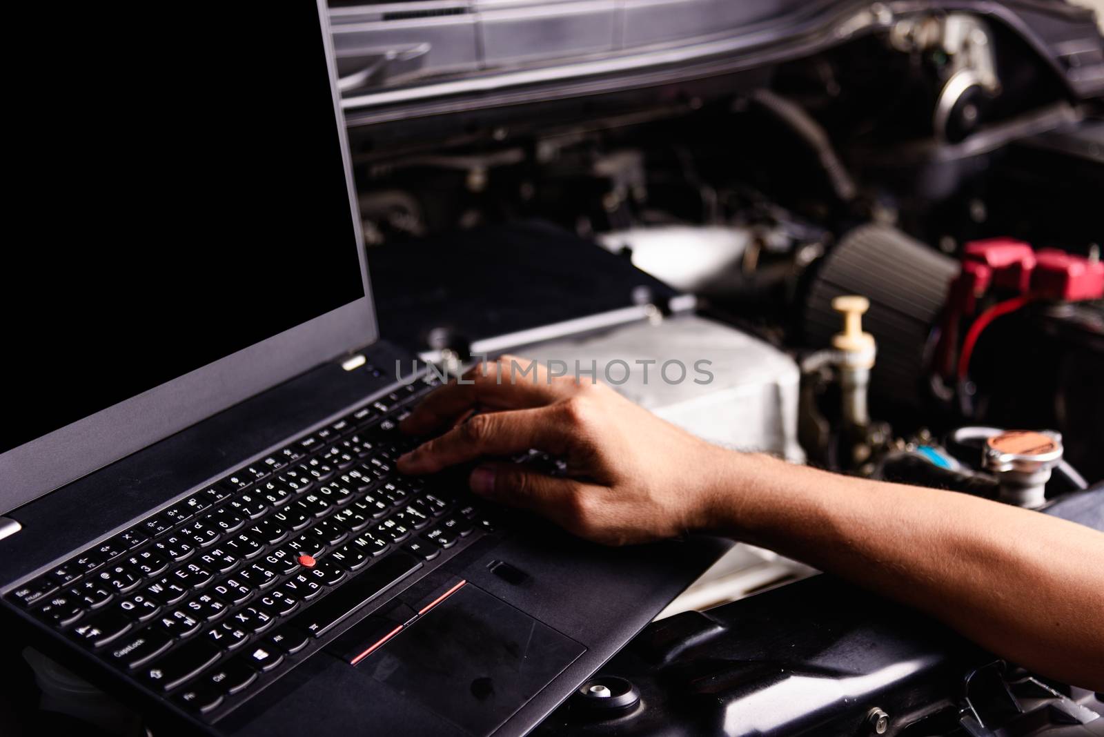 Professional car repair or maintenance mechanic engine working s by Sorapop