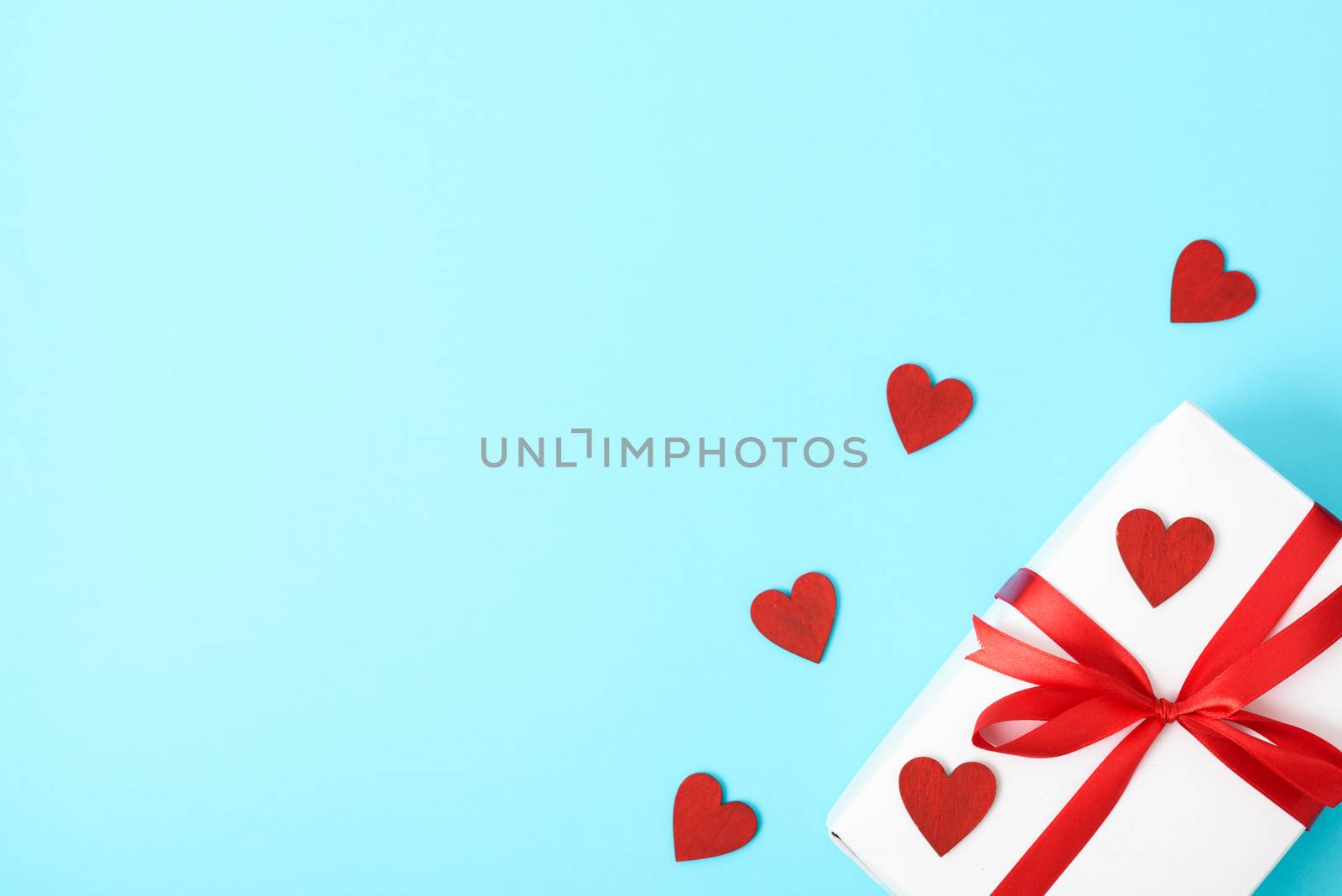 Valentine's Day Concept, Top view Flat lay, gift box and red heart on blue background with copy space for your text
