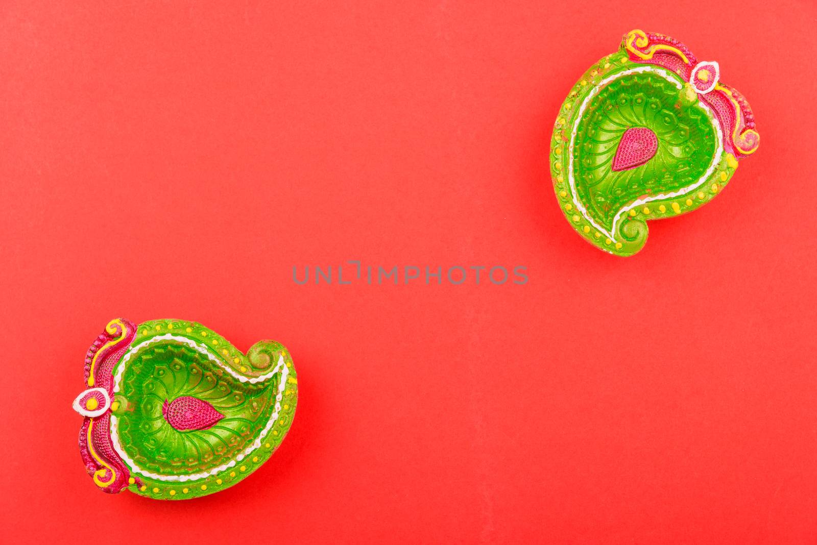 Happy Diwali Day, Flat lay top view Colorful Clay Diya lamps on red background and copy space for your text