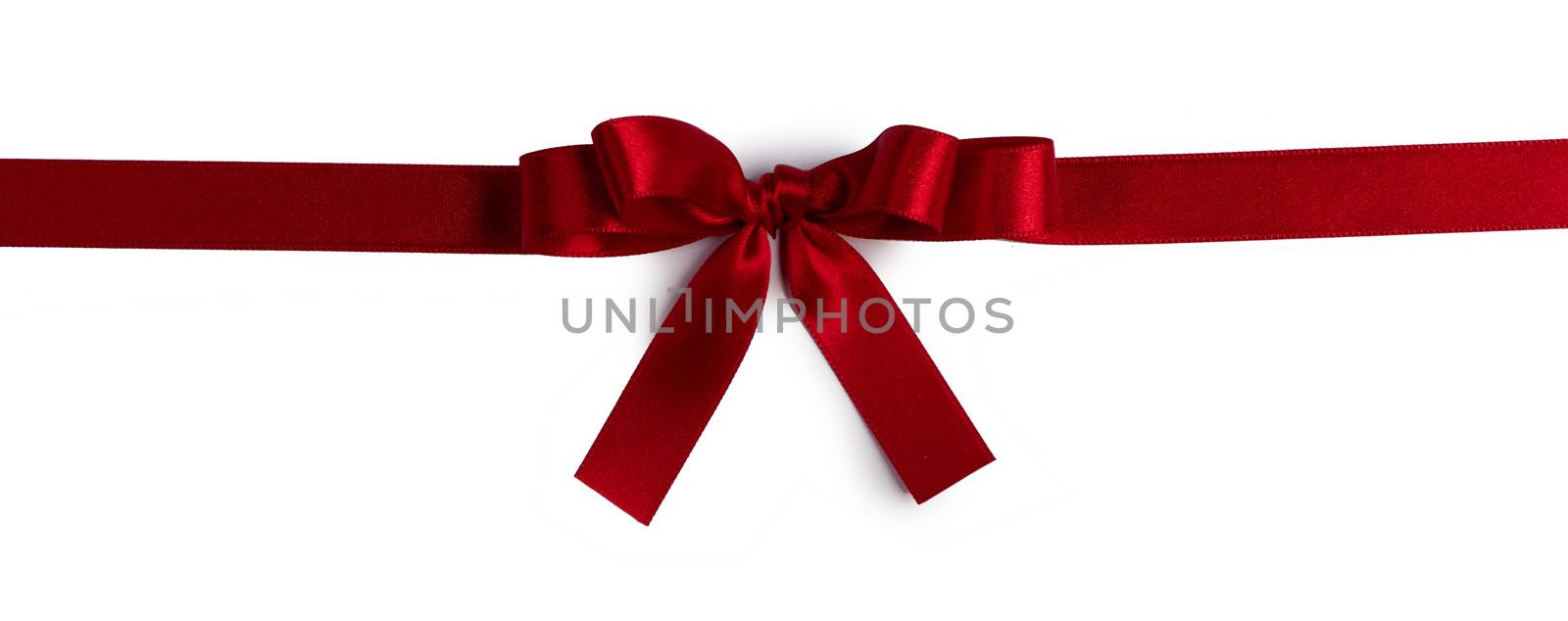 Red bow isolated on white by Yellowj