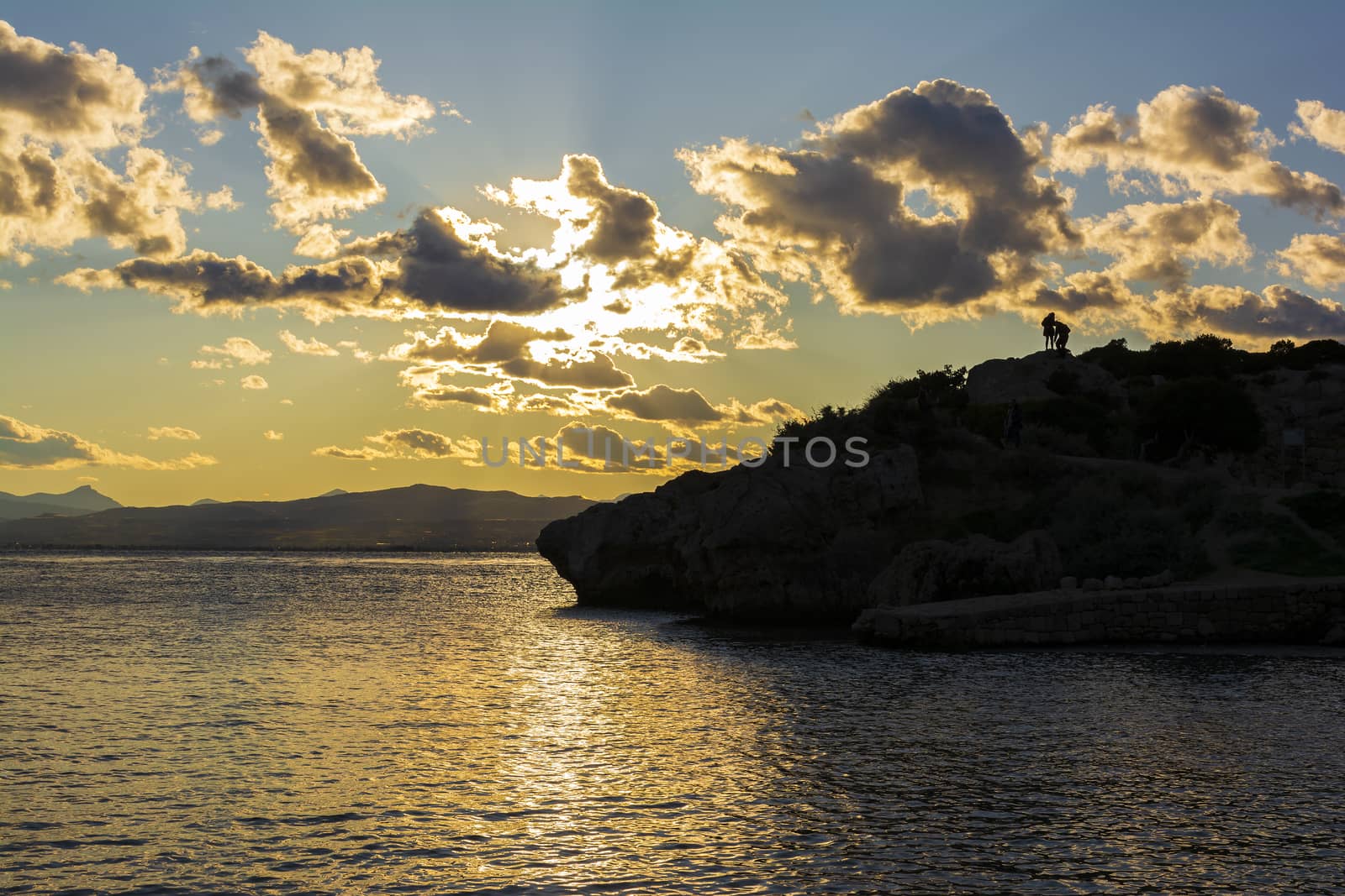 Cape Melagkavi shoreline at gulf of Corinth, Greece. Sunset.