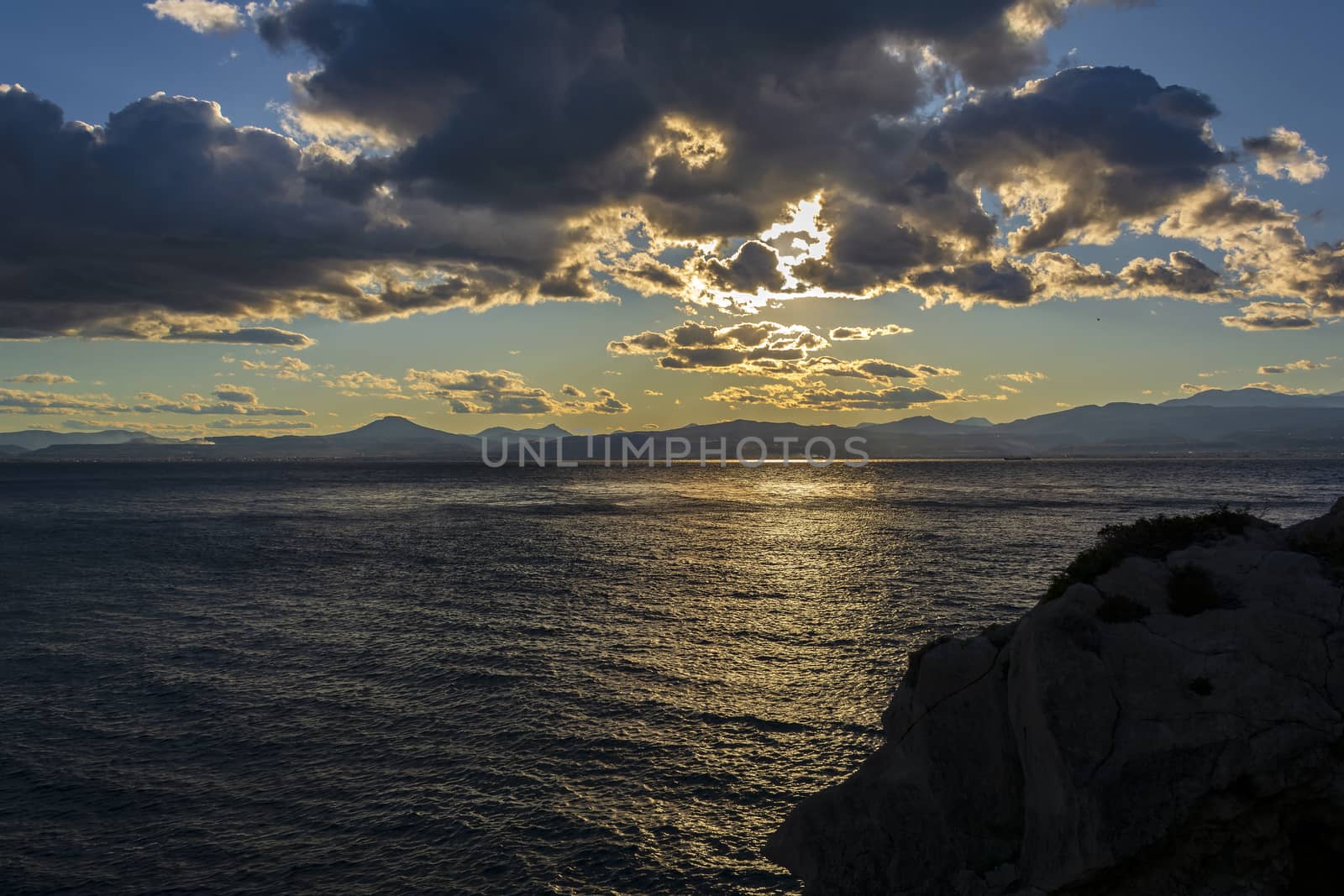 Cape Melagkavi shoreline at gulf of Corinth, Greece. Sunset.