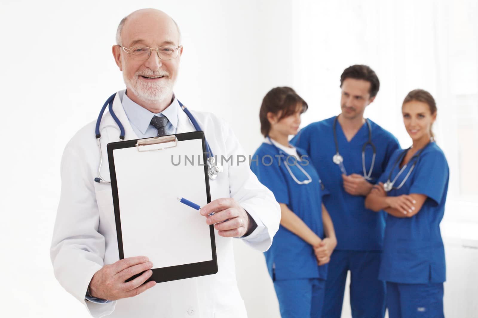 Group of doctors , senior specialist holding folder with blank document isolated on white background, studio shot