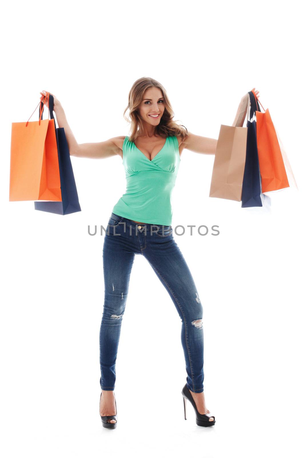 Shopping woman happy smiling holding shopping bags isolated on white background