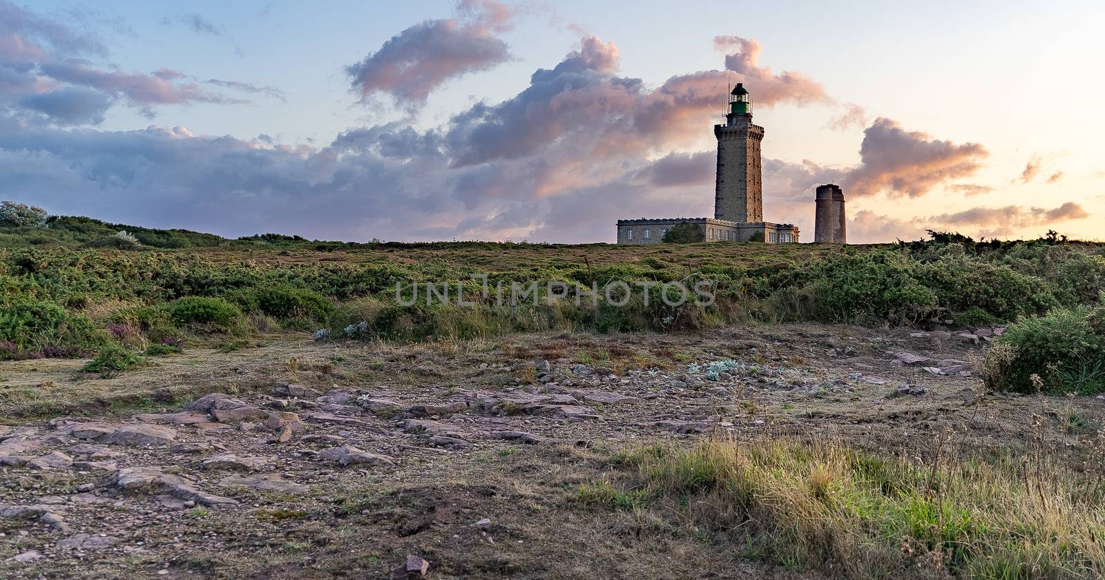 Romantic sunset in France sea coast travel attraction lighthouse