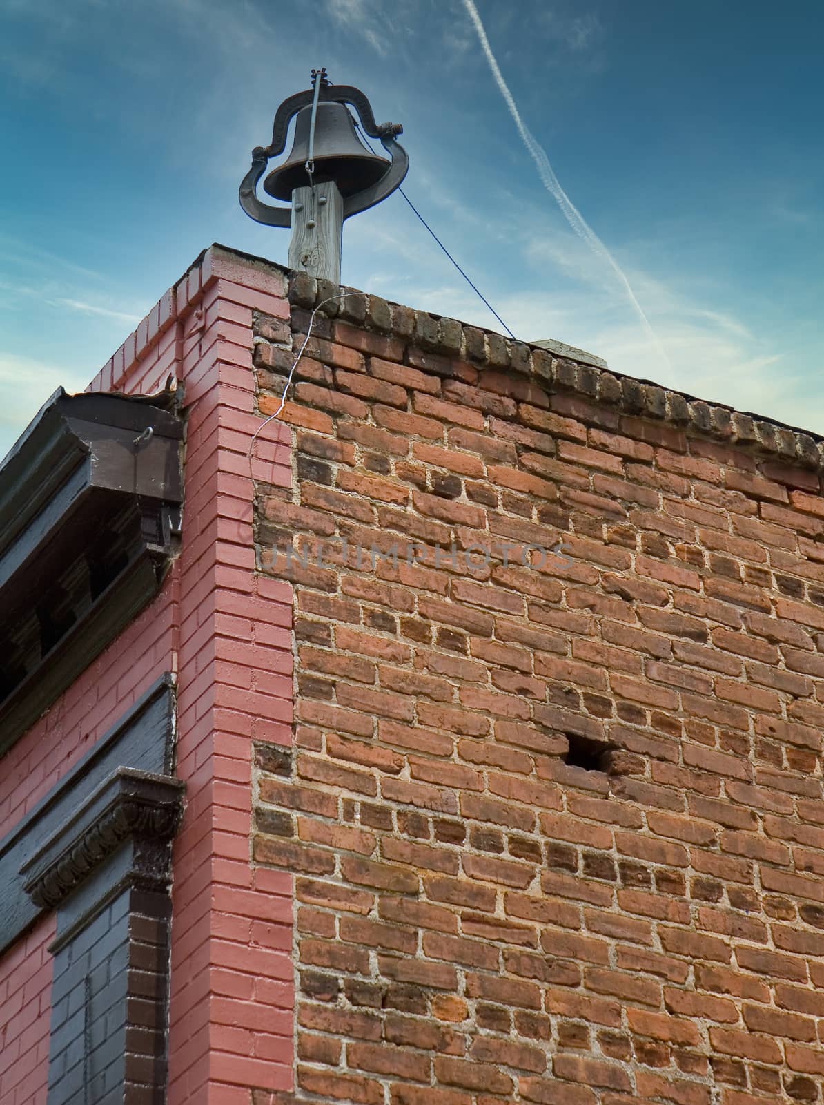 Bell on Old Brick Building by dbvirago