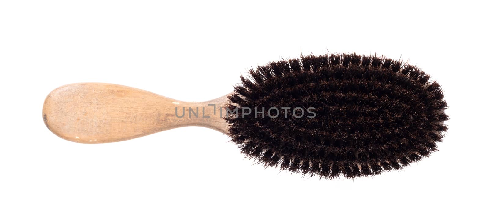Old hair brush with some hair in it by michaklootwijk