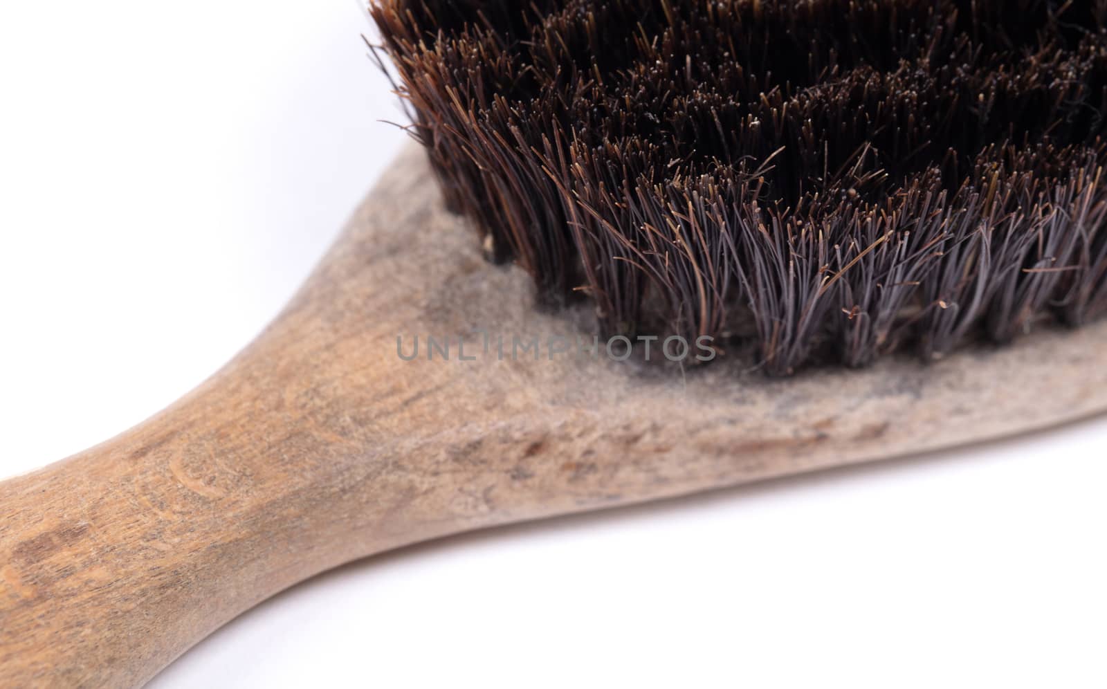 Old hair brush with some hair in it, isolated on white