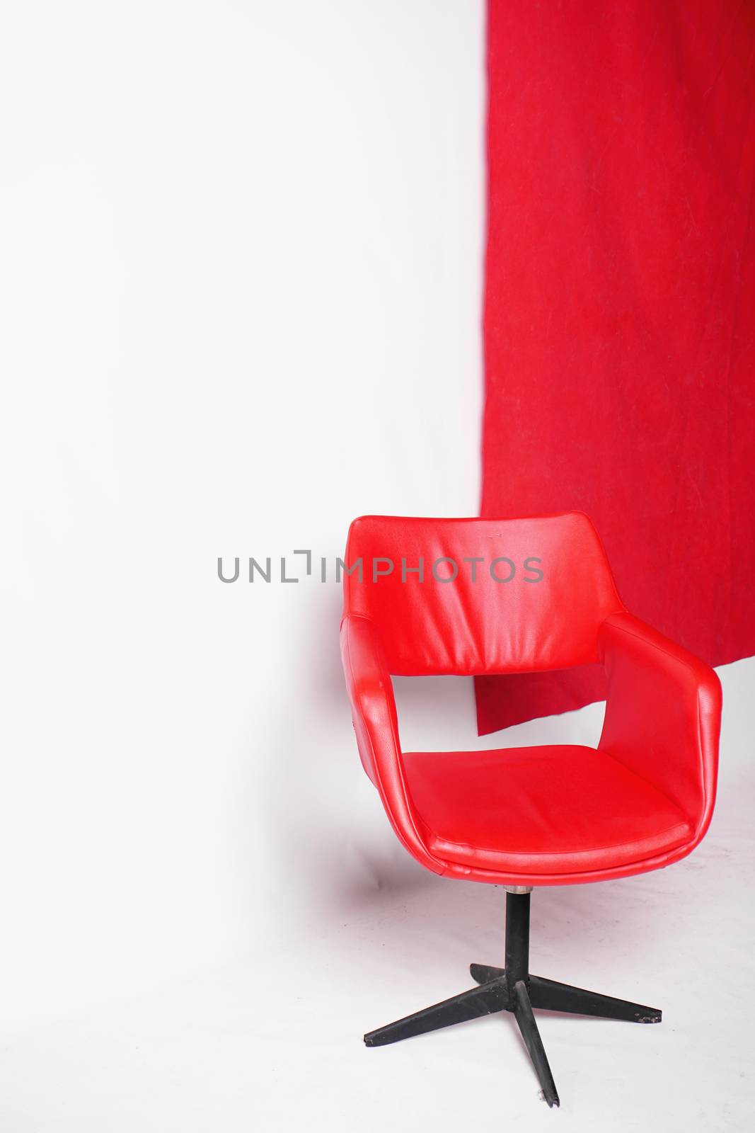 Modern red armchair on a white background in the studio by natali_brill