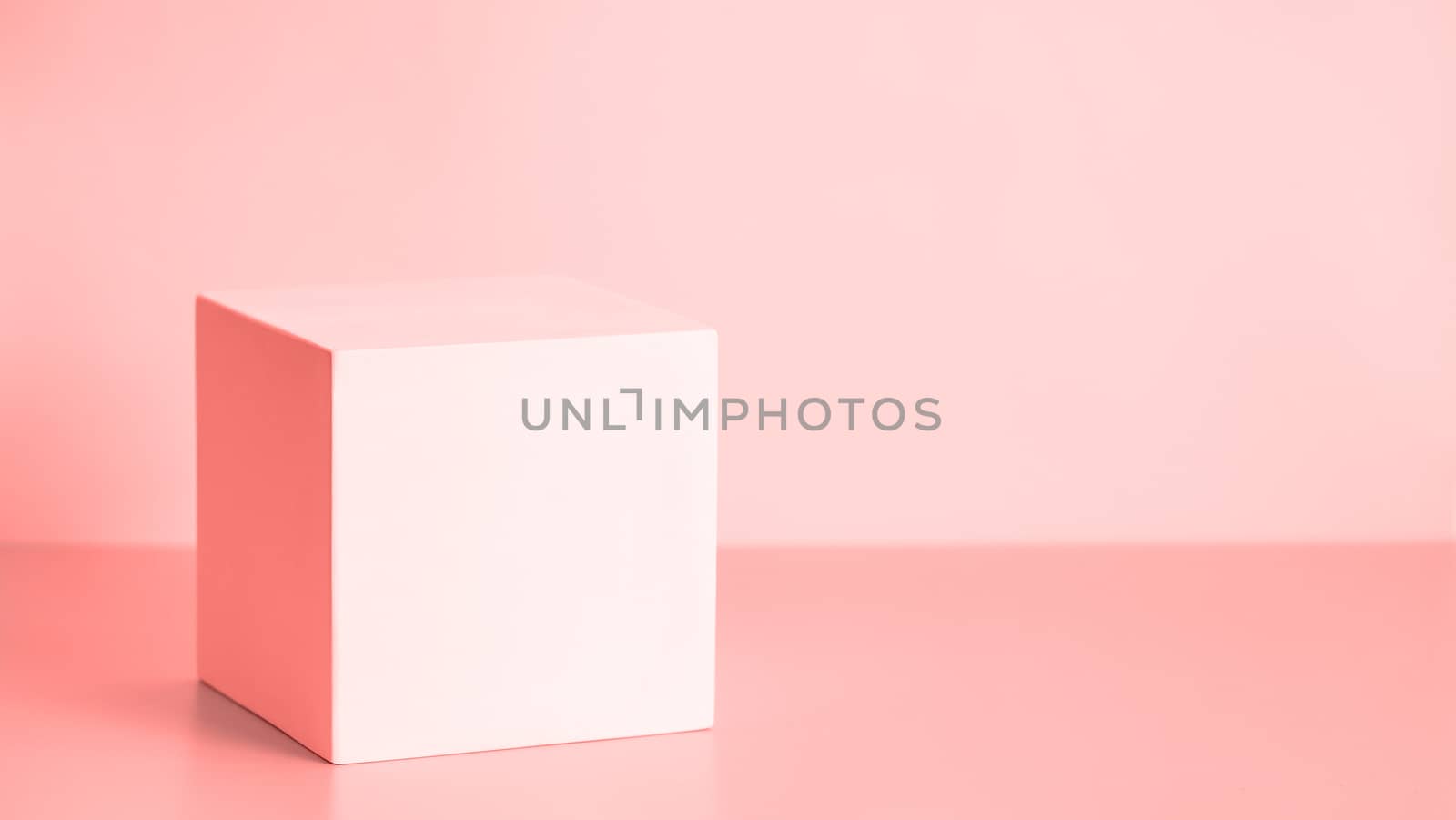 Abstract background for branding, identity and packaging presentation. Light pink cub podium on pink paper background. Copy space for text, design or mock up product. Banner