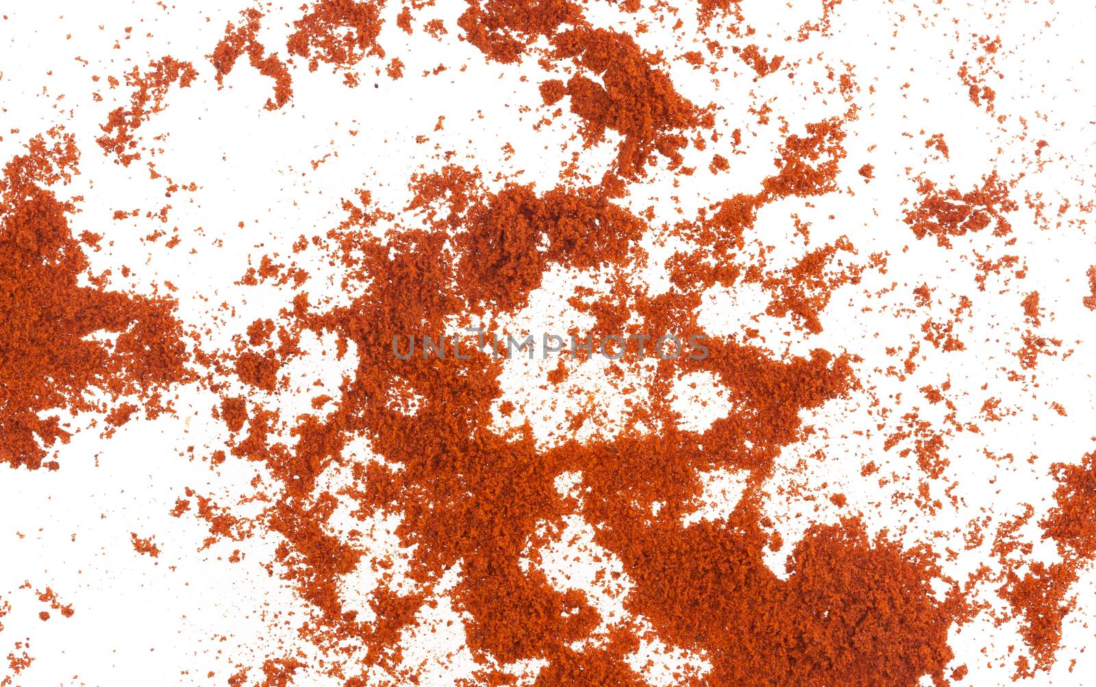 Scattered red paprika powder isolated on white background. Top view by xamtiw