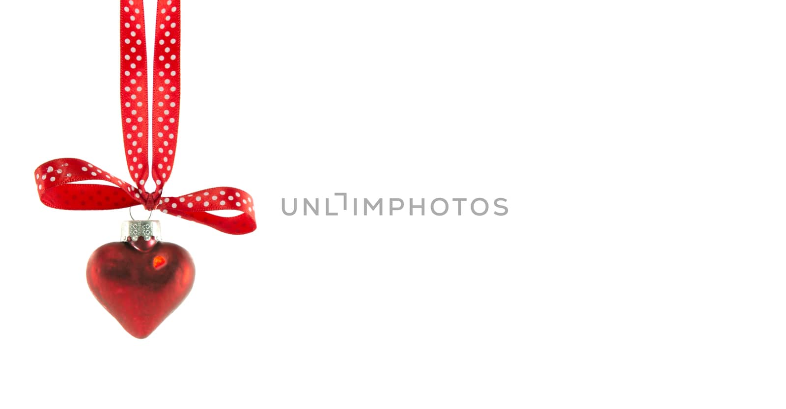 red christmas ball in heart shape isolated on white