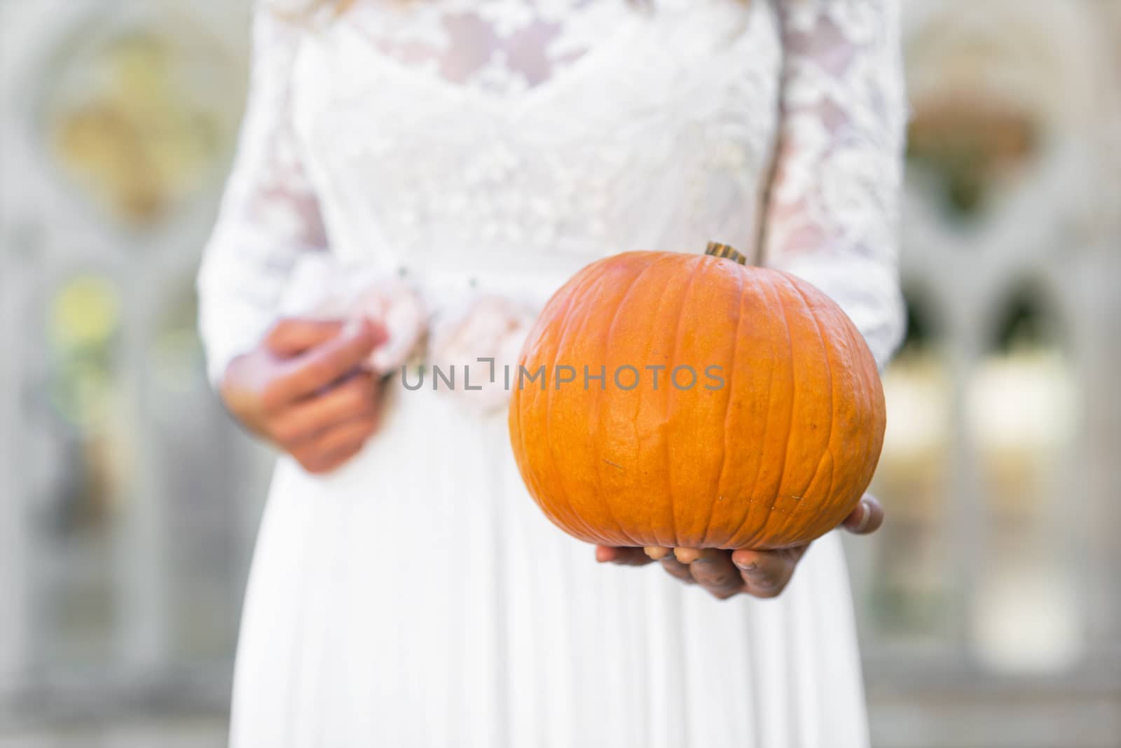 Cinderella princess holding pumpkin in her hands. Fairy tale concept