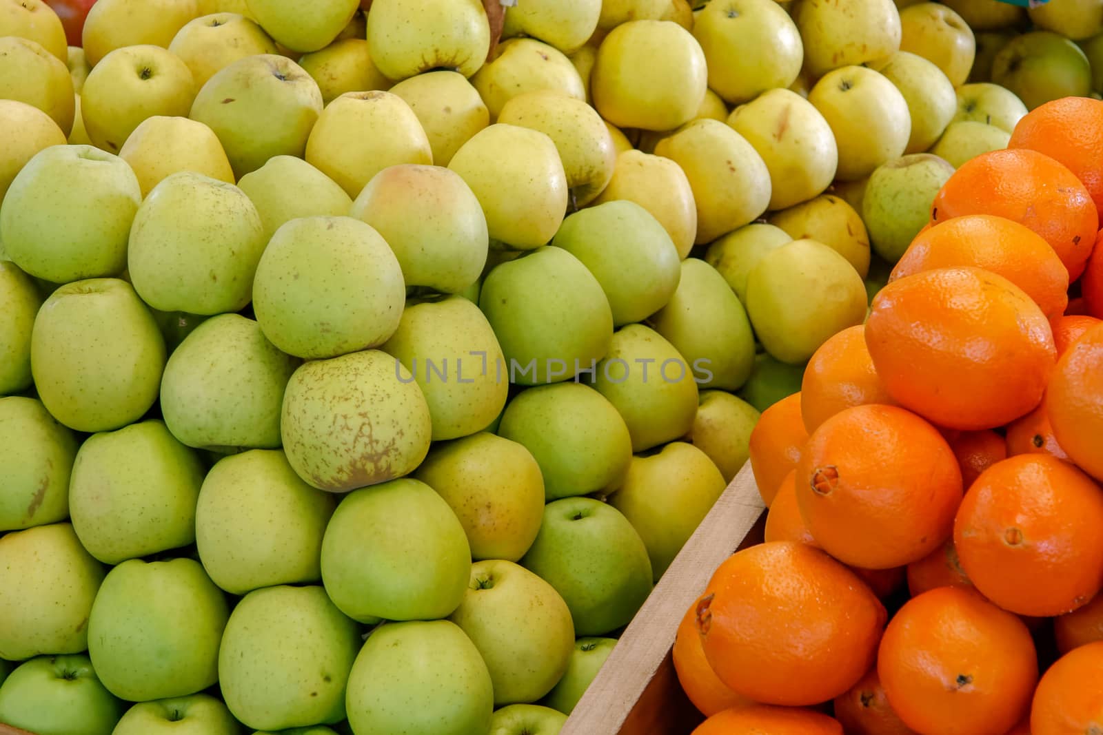 Close-up of Apples and Oranges on a Stall in Funchal Covered Mar by phil_bird