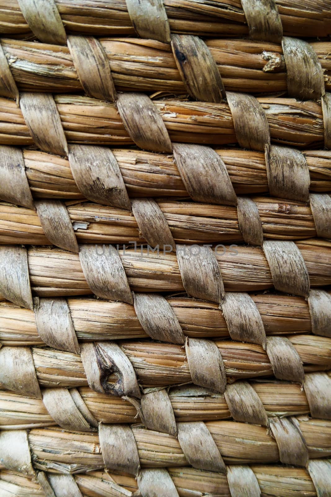 Curved lines pattern in a straw basket background