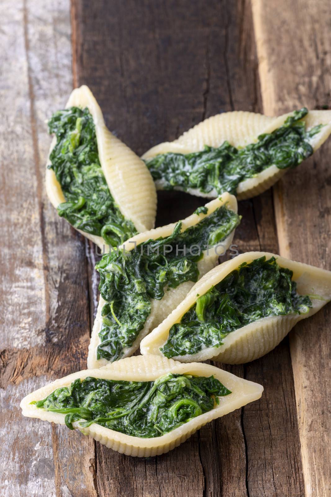 italian conchiglino pasta filled with spinach by bernjuer