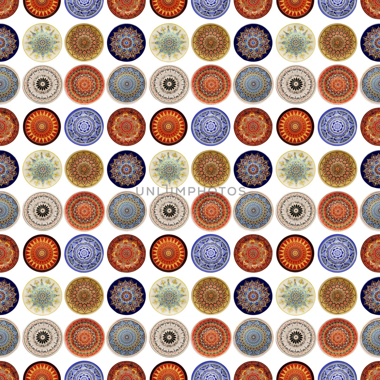 Seamless background from a set of decorative ceramic dishes hand-painted with acrylic paints with a floral pattern.
