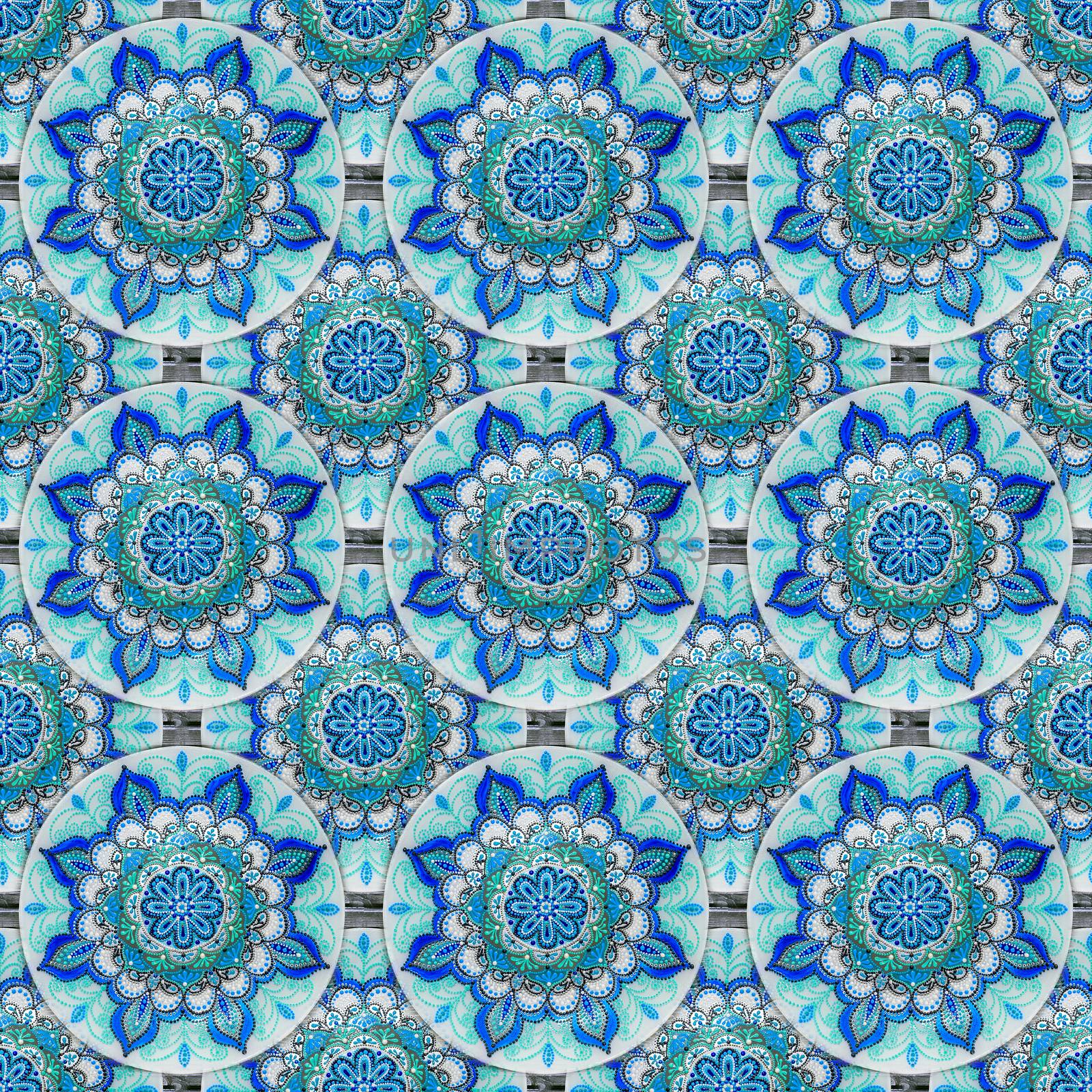 Seamless background from a set of decorative ceramic dishes hand-painted with acrylic paints with a floral pattern.