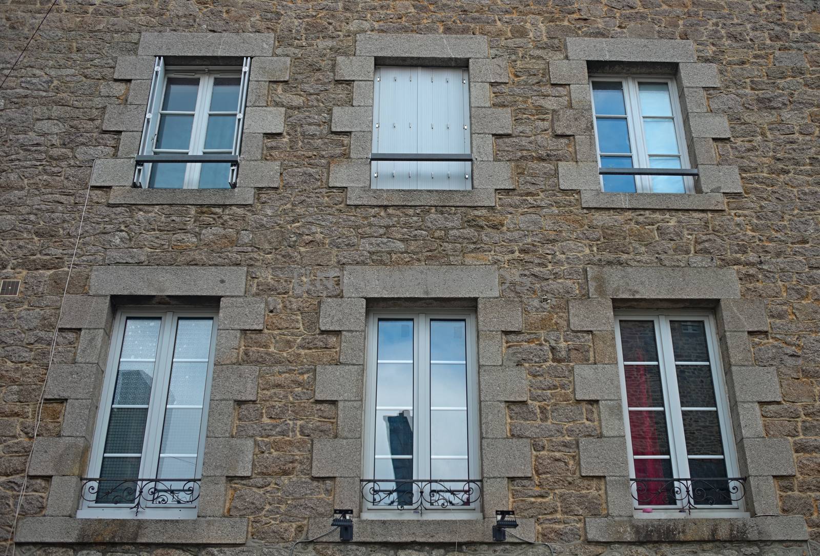 Traditional french stone building with many windows