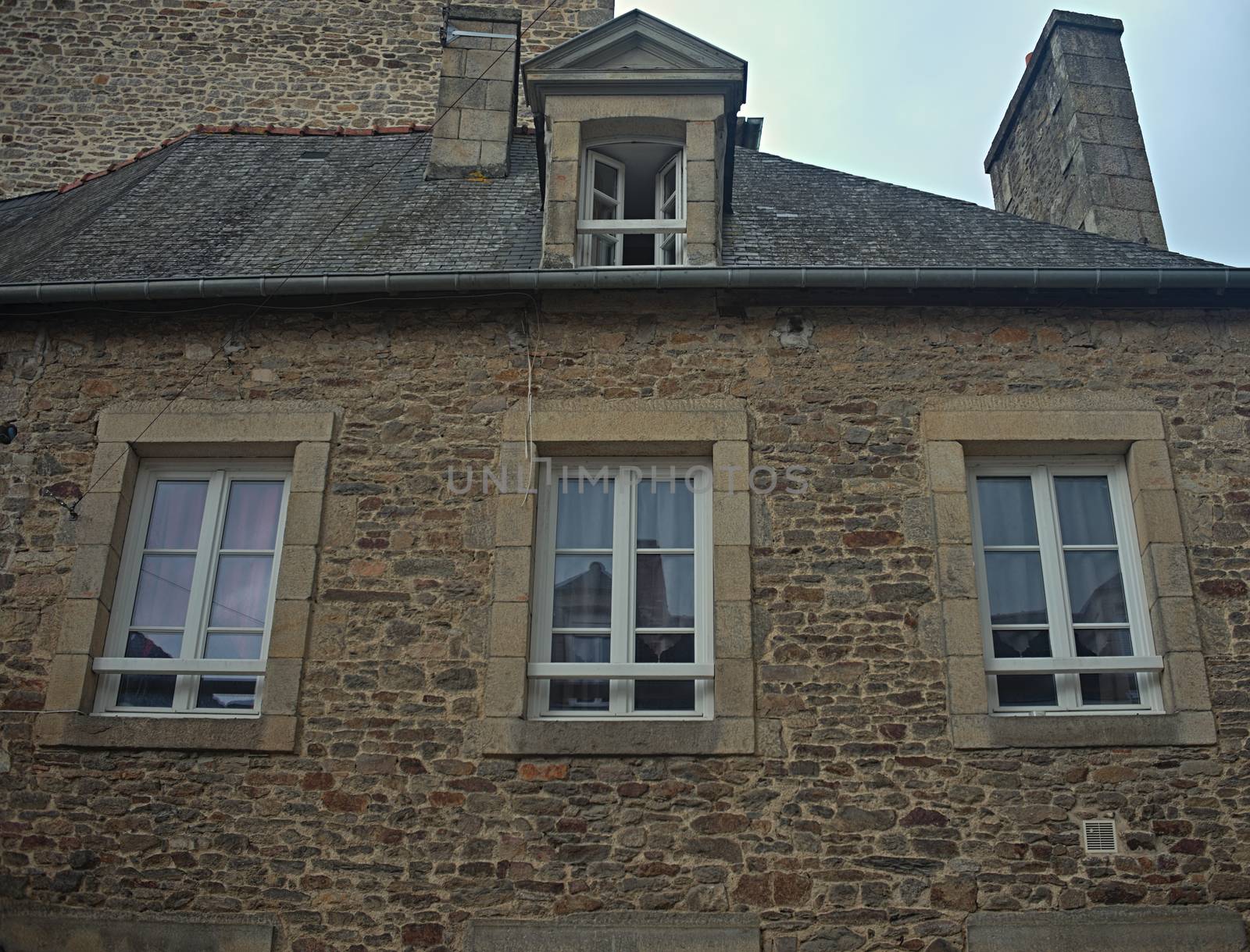 Traditional french stone building with many windows