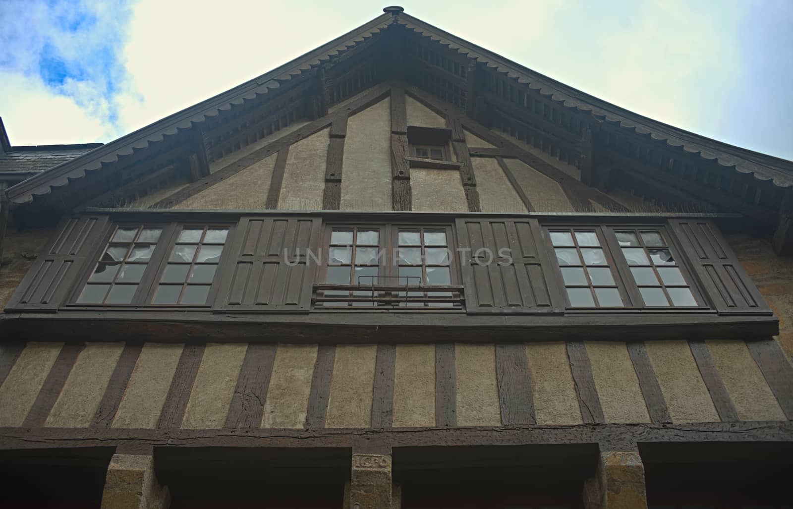 View from bellow on old medieval french house by sheriffkule