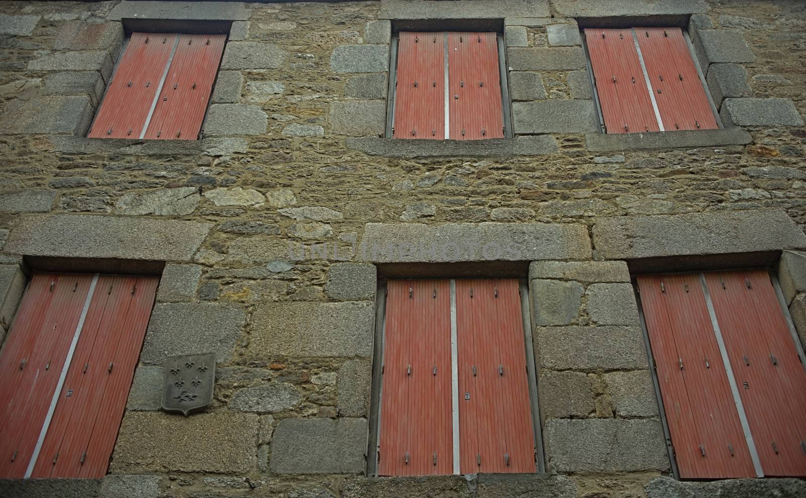 Traditional french stone building with many windows by sheriffkule