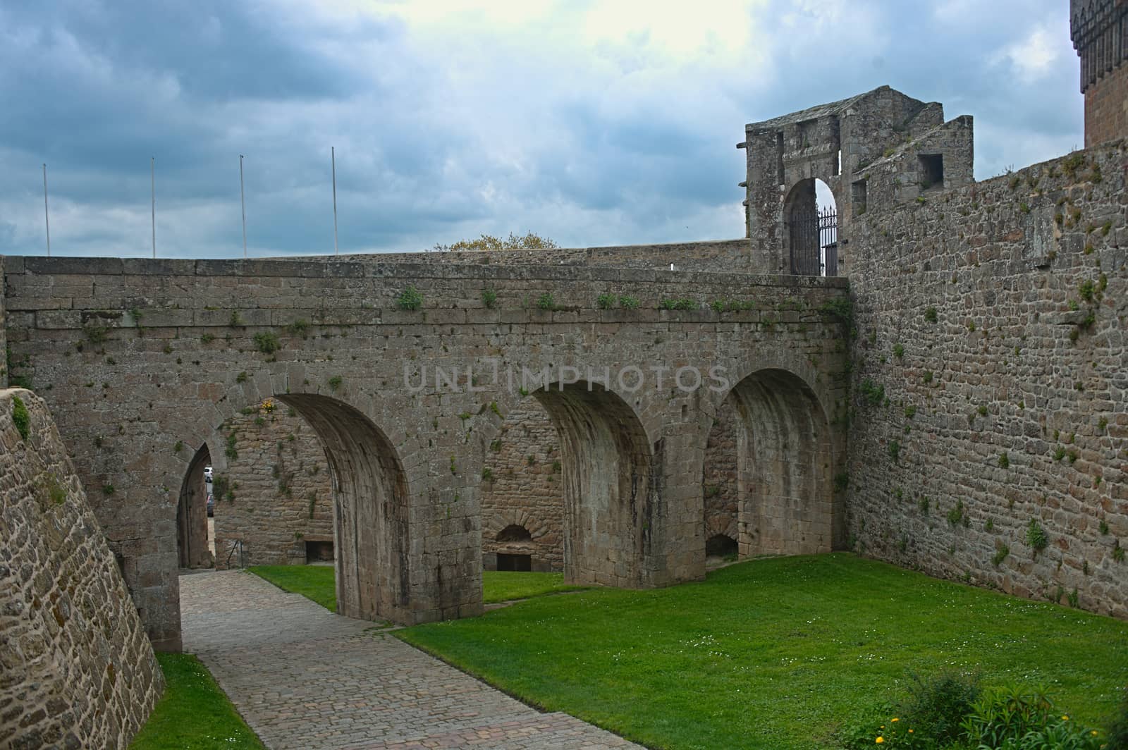 Big stone walls, gate and bridge at Dinan fortress, France by sheriffkule