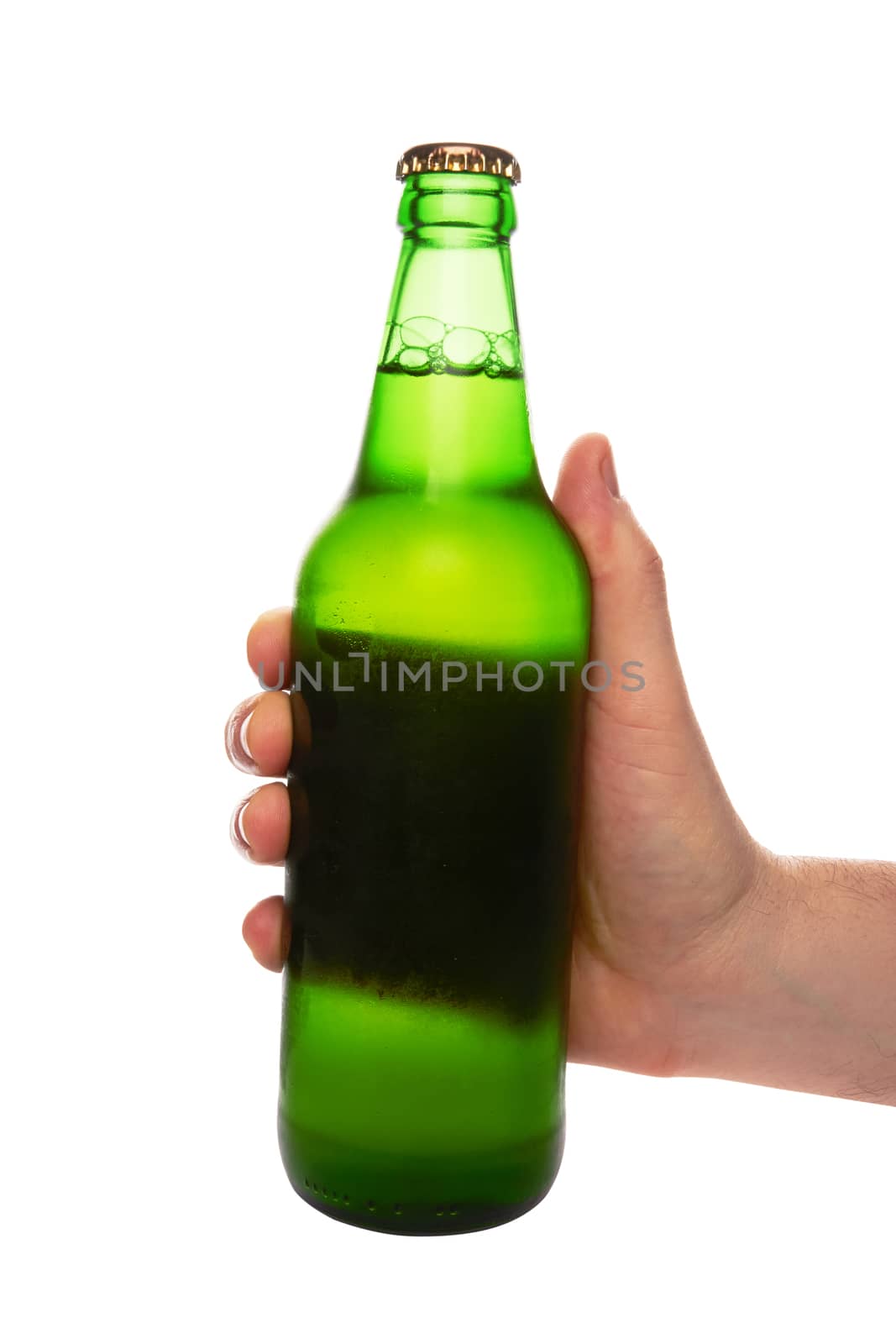hand holding a green beer bottle without label isolated on white background