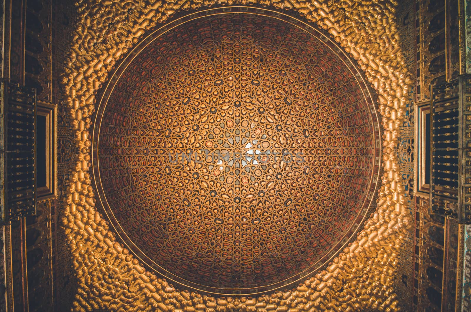 Multiple geometric and colorful figures at  Sevilla's Alcazar dome, Spain