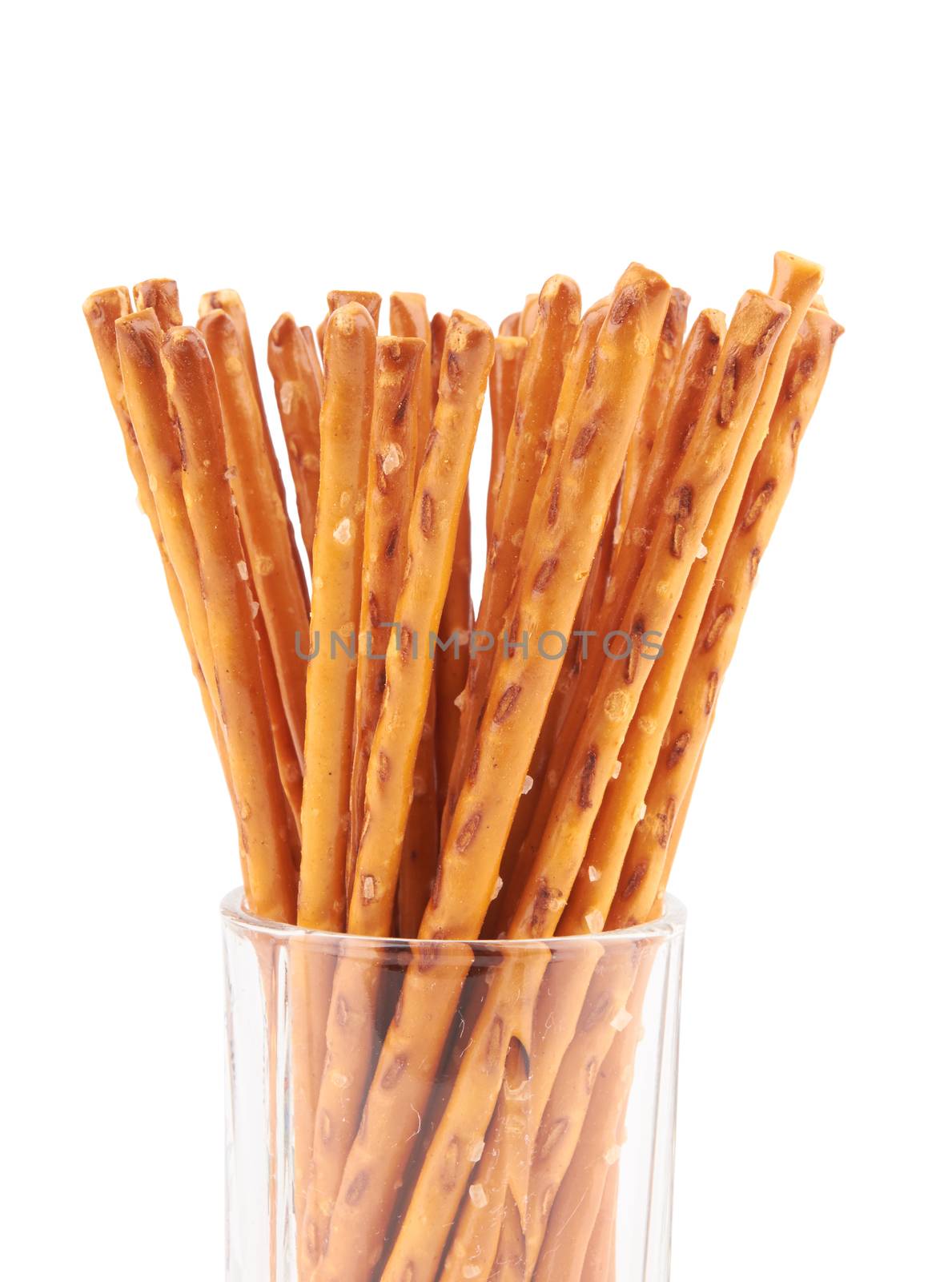 salted pretzels in a glass isolated on white background