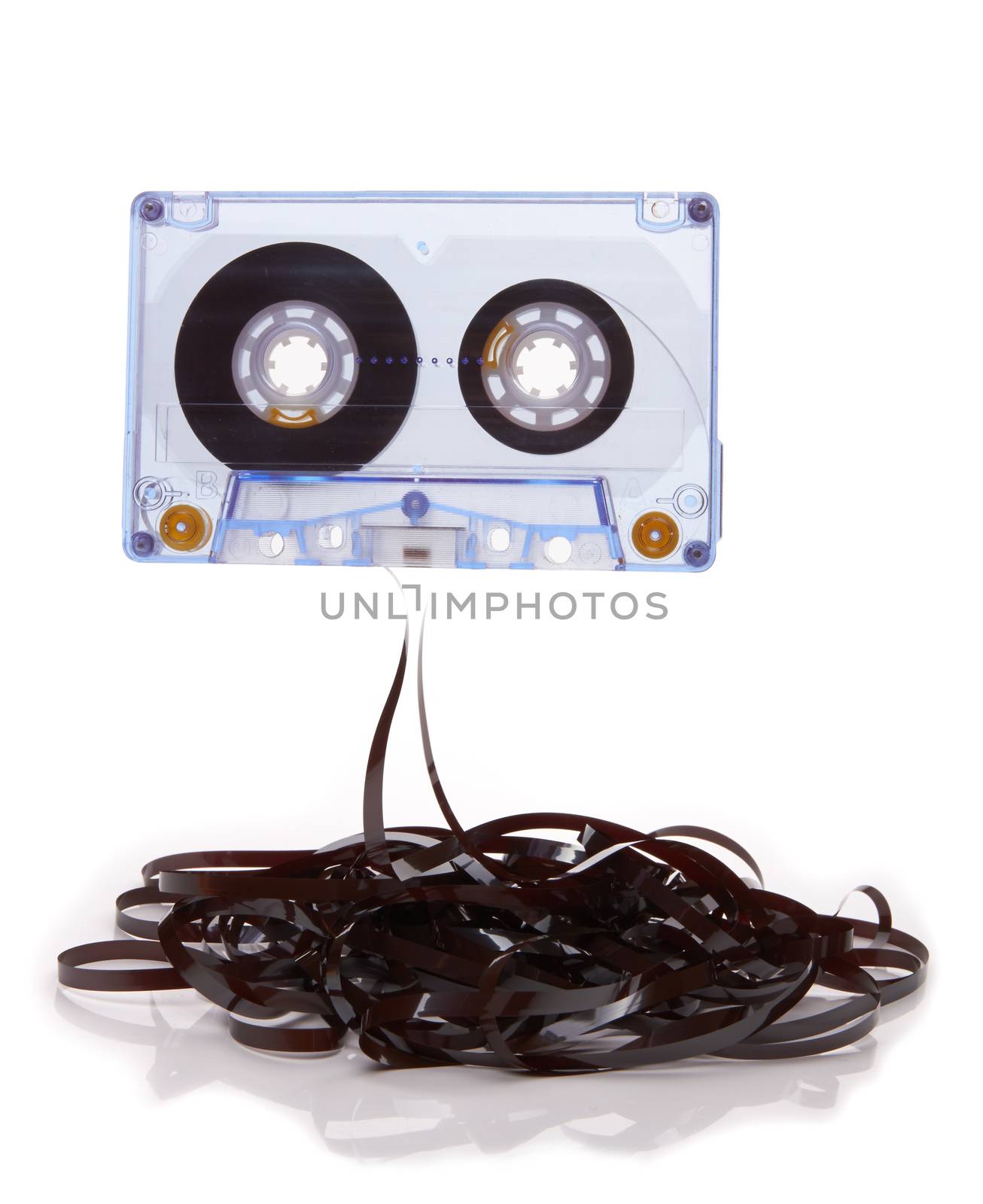 Audio cassette with tape tangle on white background