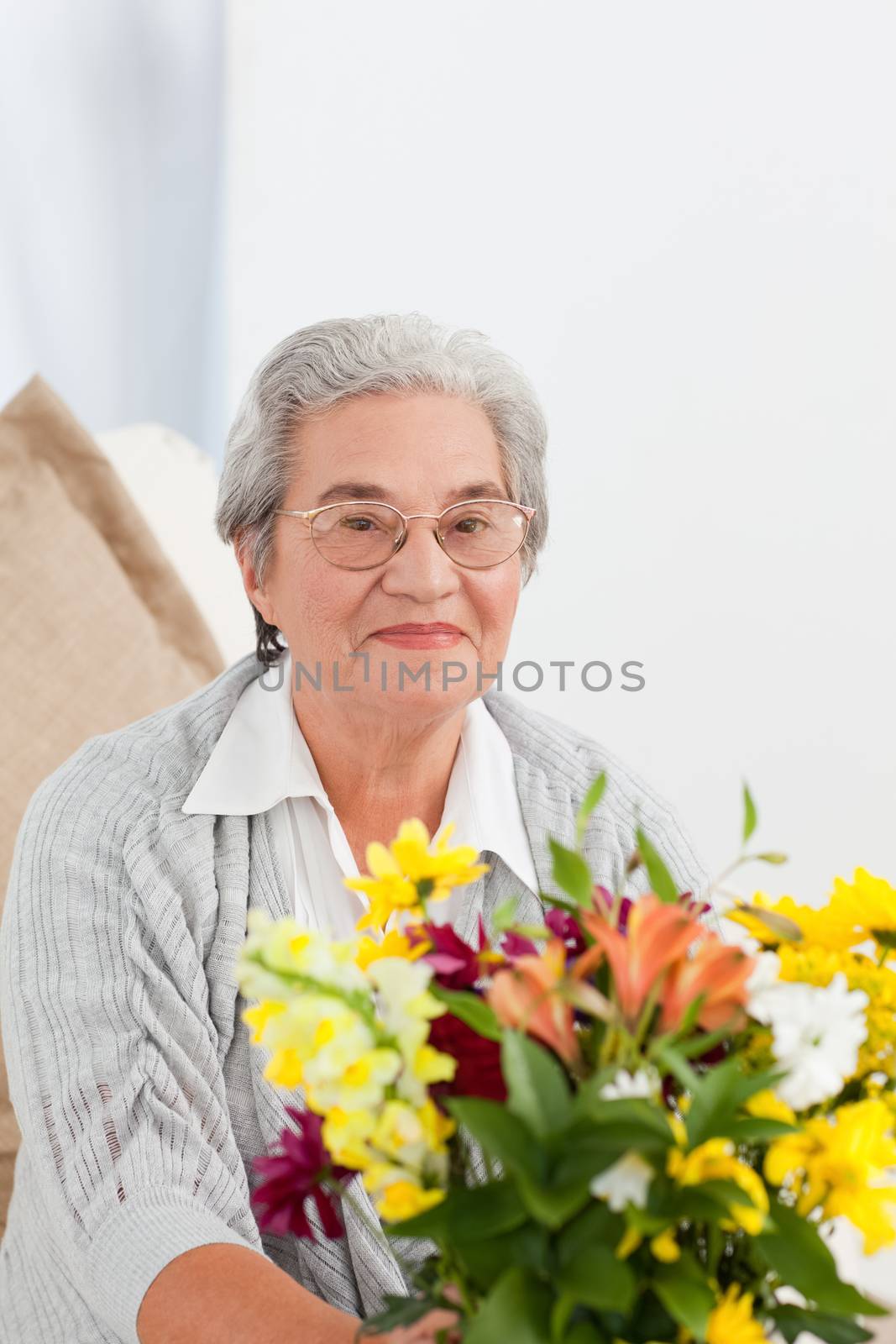 Senior with flowers at home