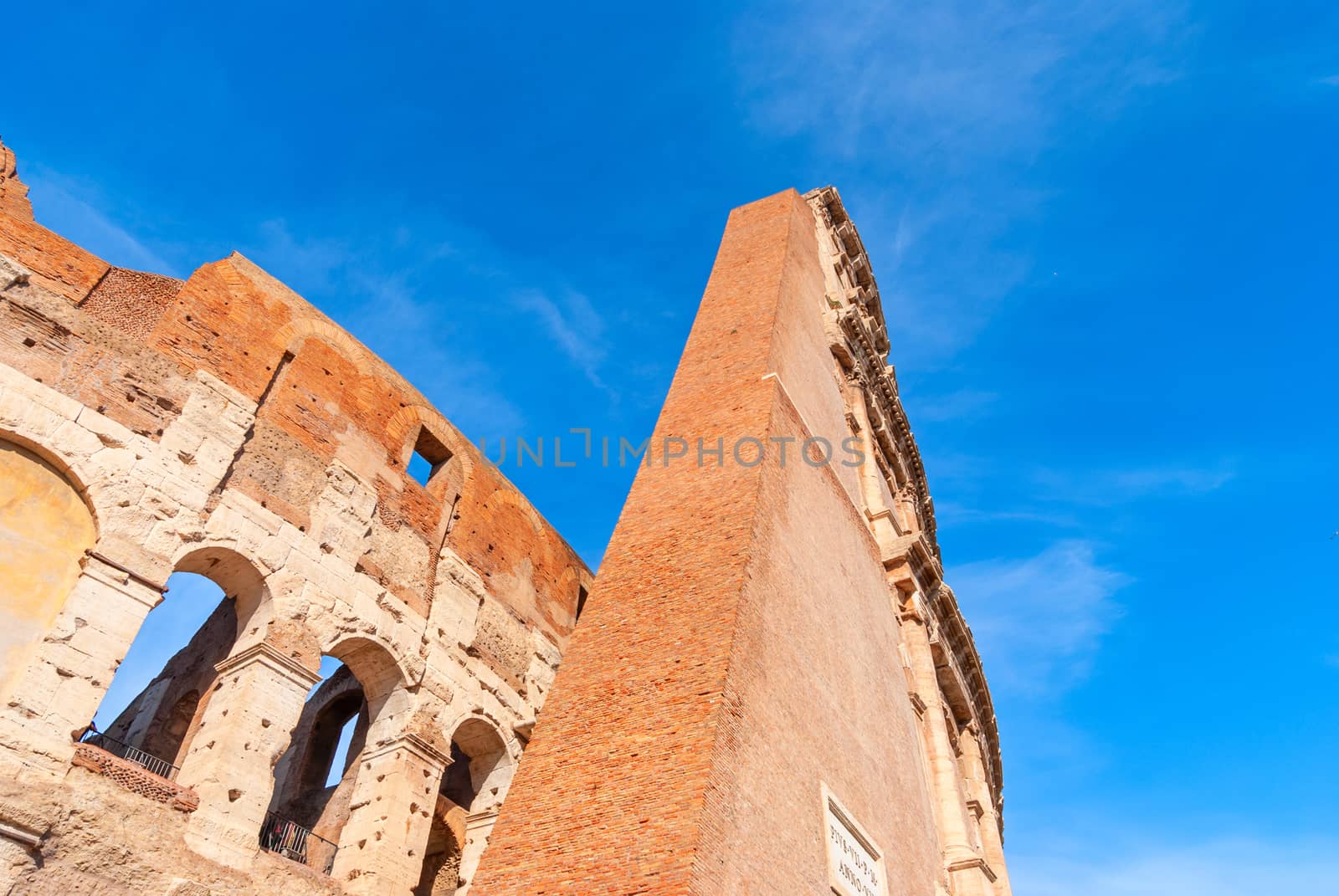 Colosseum in Rome, Italy. Ancient Roman Colosseum is one of the main tourist attractions in Europe. People visit the famous Colosseum in Roma center.