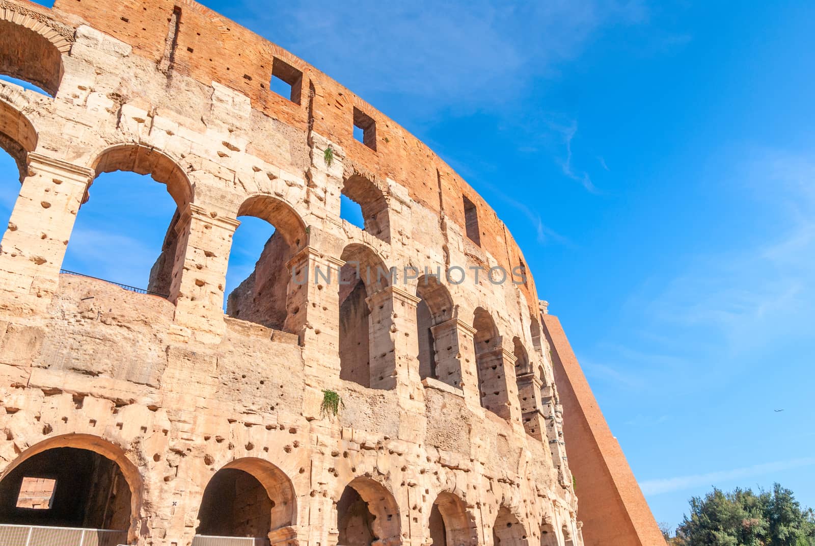 Colosseum in Rome, Italy. Ancient Roman Colosseum is one of the main tourist attractions in Europe. People visit the famous Colosseum in Roma center. Scenic nice view of Colosseum ruins in summer.