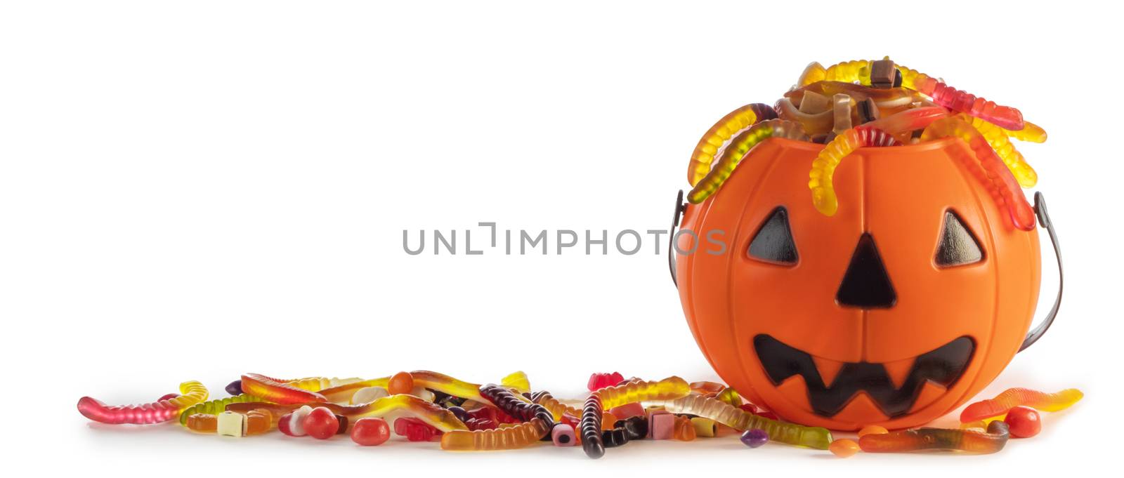 Halloween candies in Jack-O-Lantern bag isolated on white background