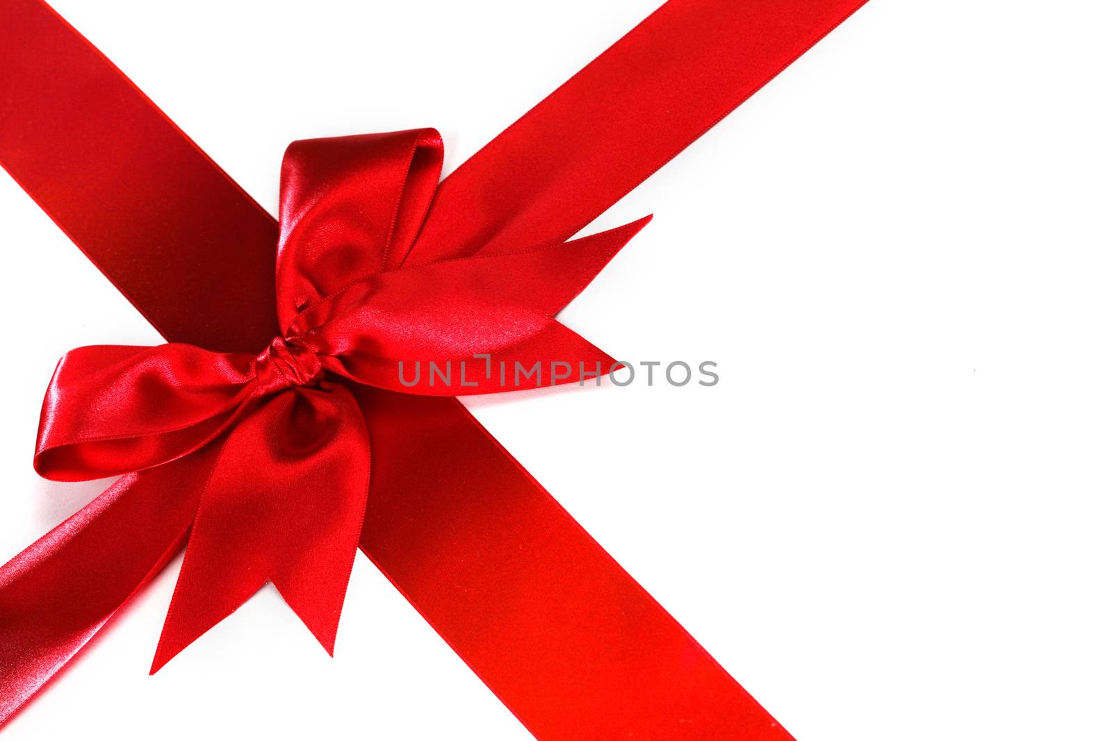 Decorative red satin bow isolated on white background