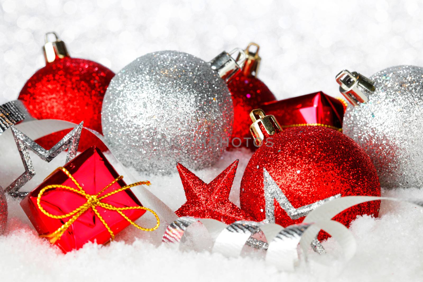 Christmas card with beautiful red and silver decorations in snow