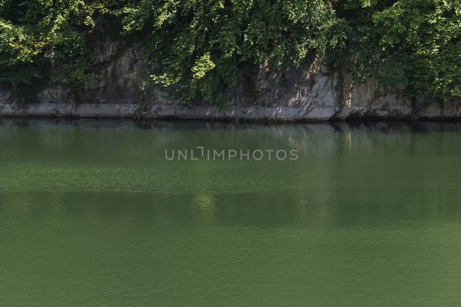 Lake with banks on the site of a former quarry for the extraction of limestone