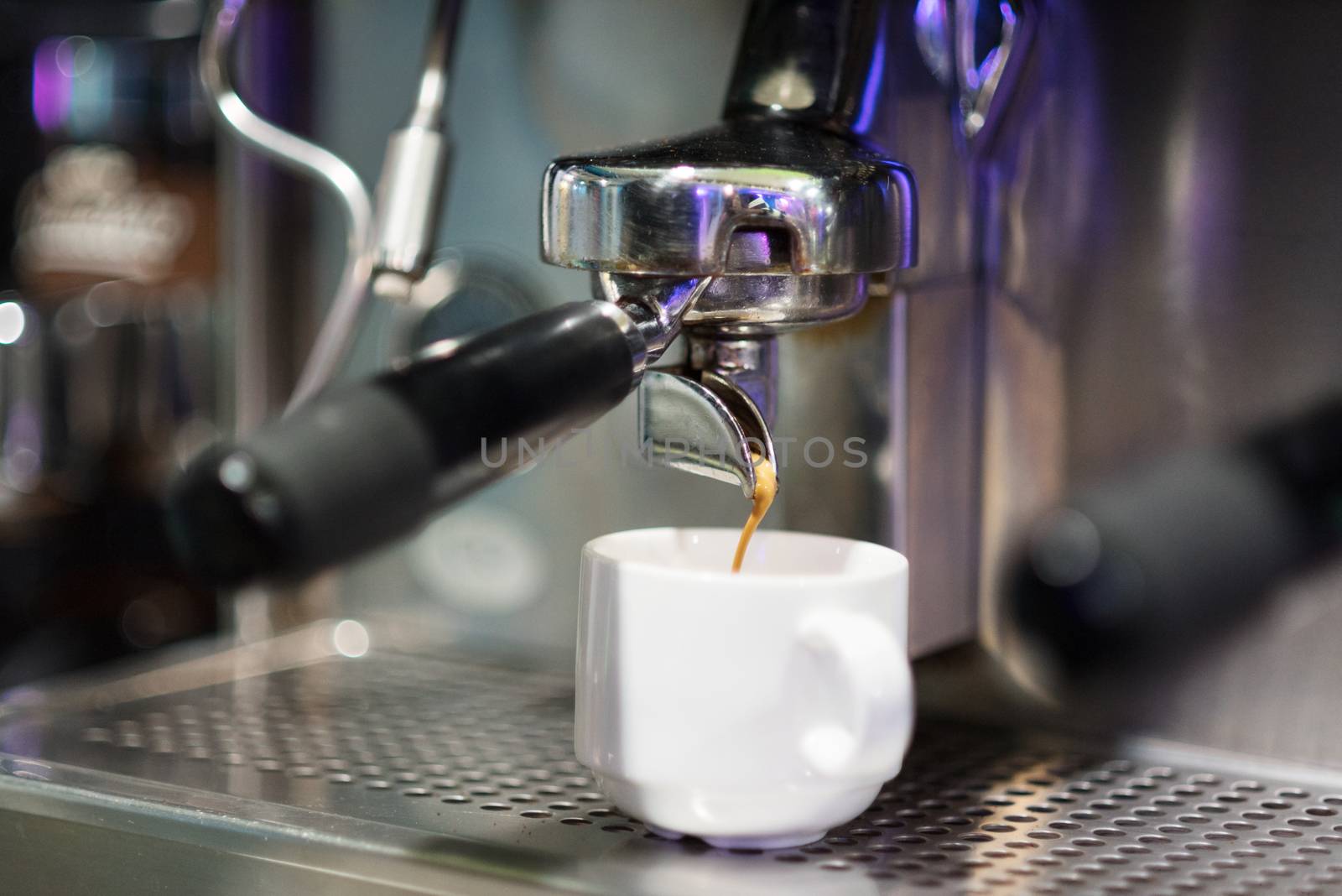 Coffee machine preparing espresso close up