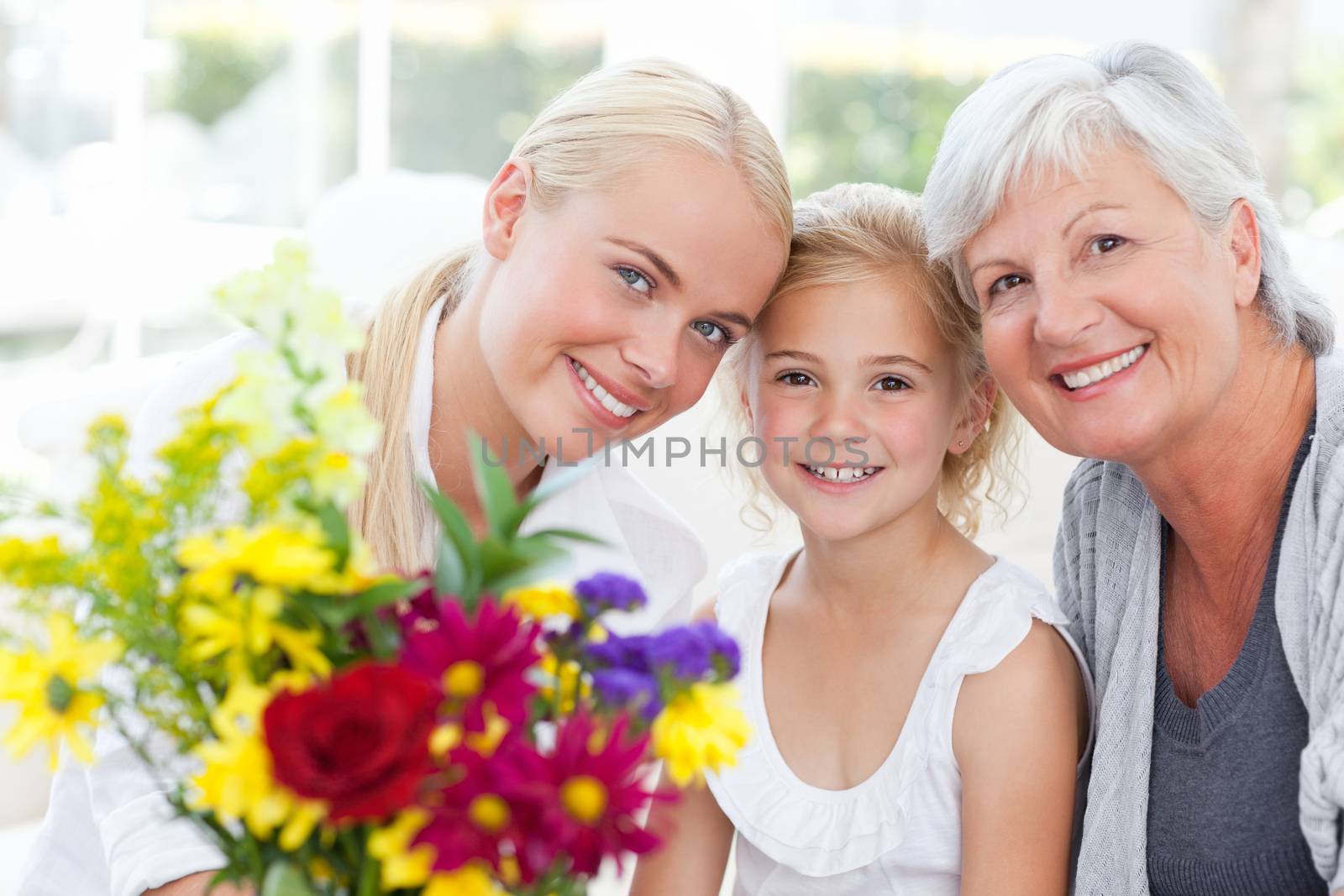 Radiant family with flowers at home