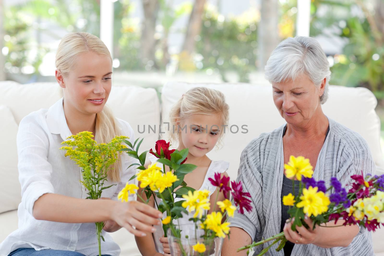 Radiant family with flowers at home