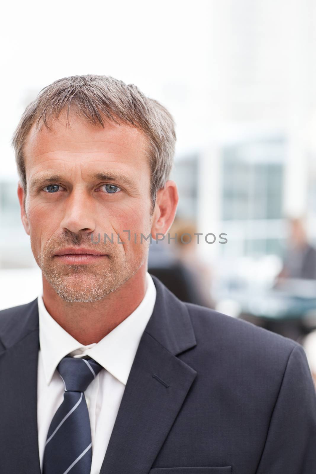 Serious businessman in his office by Wavebreakmedia