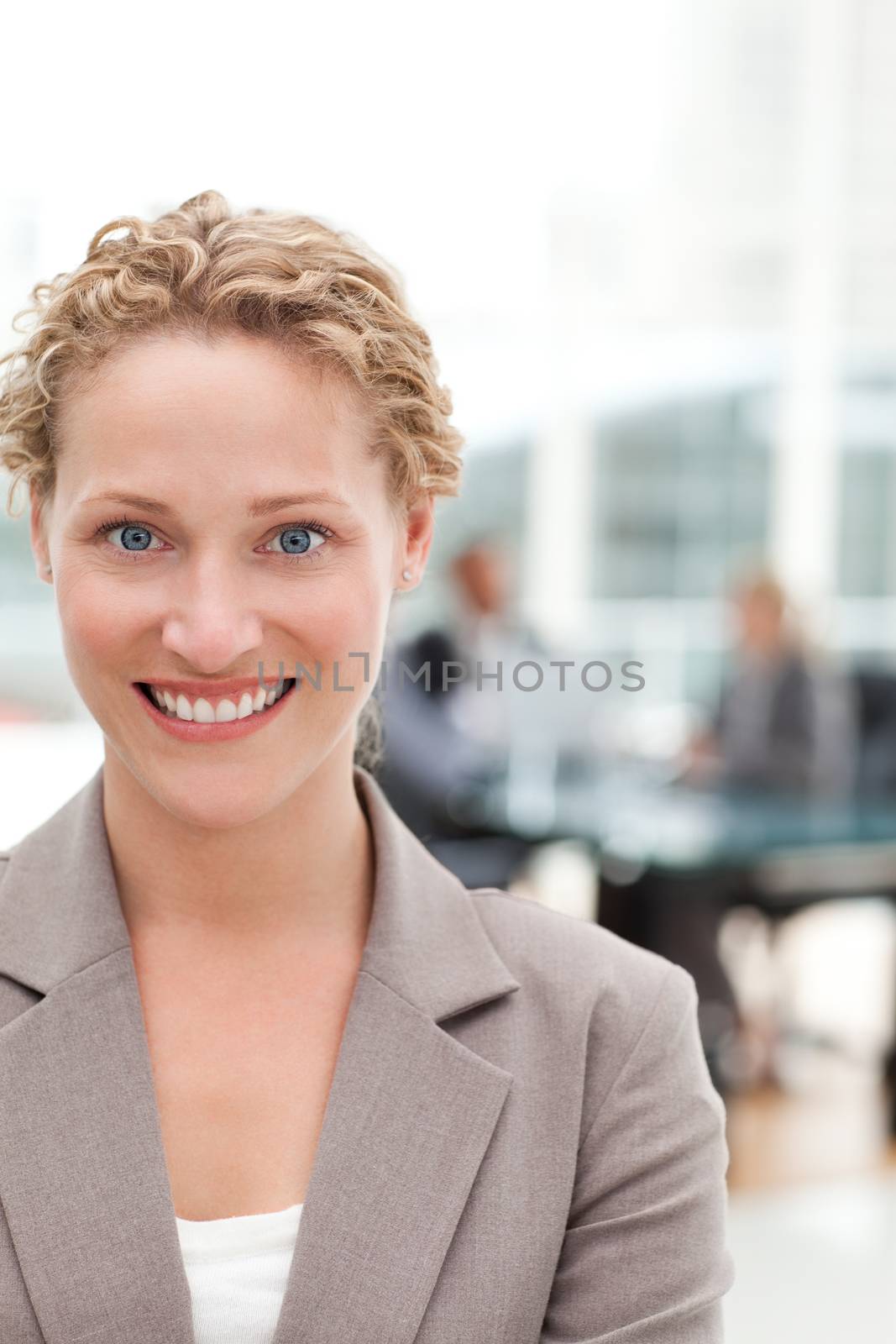 Smiling businesswoman in her office by Wavebreakmedia