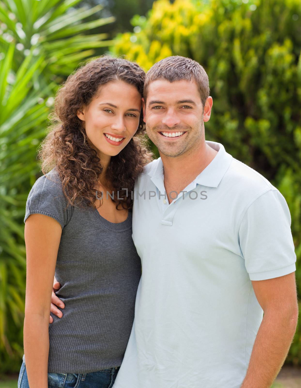 Happy couple hugging in the garden by Wavebreakmedia