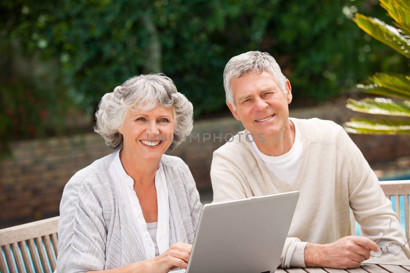 Retired couple working on their laptop by Wavebreakmedia