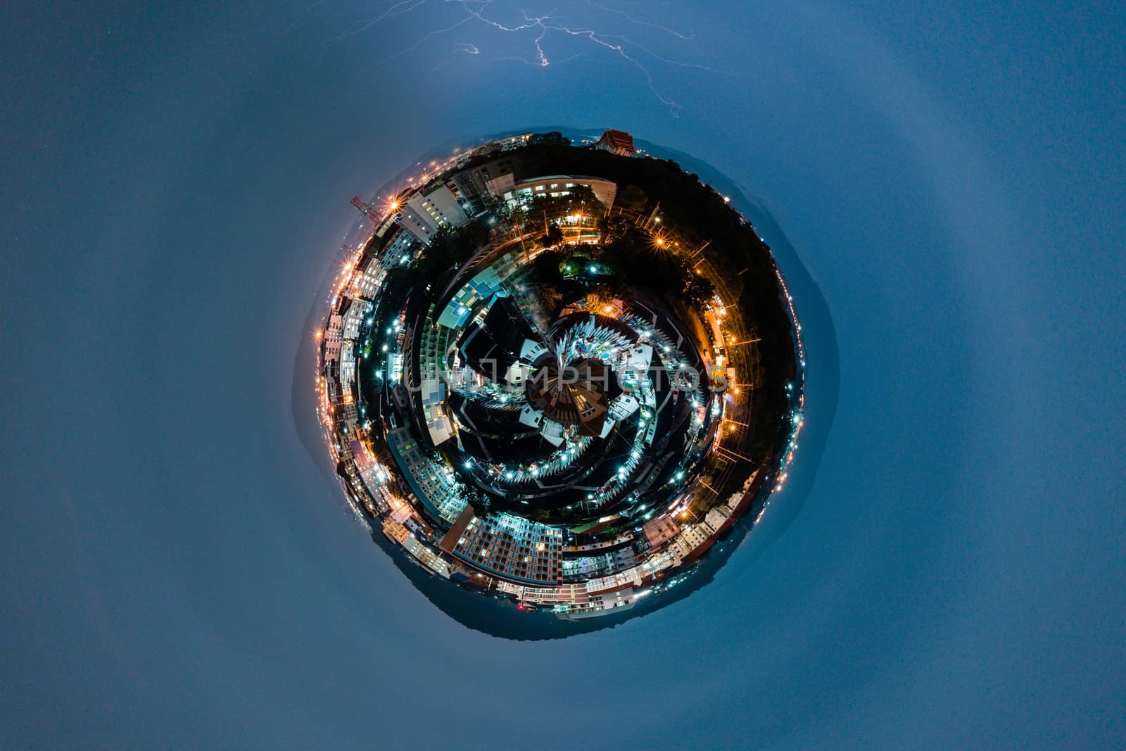Aerial 360 degrees Panorama of aerial view of small city concept at night with lightning by peerapixs