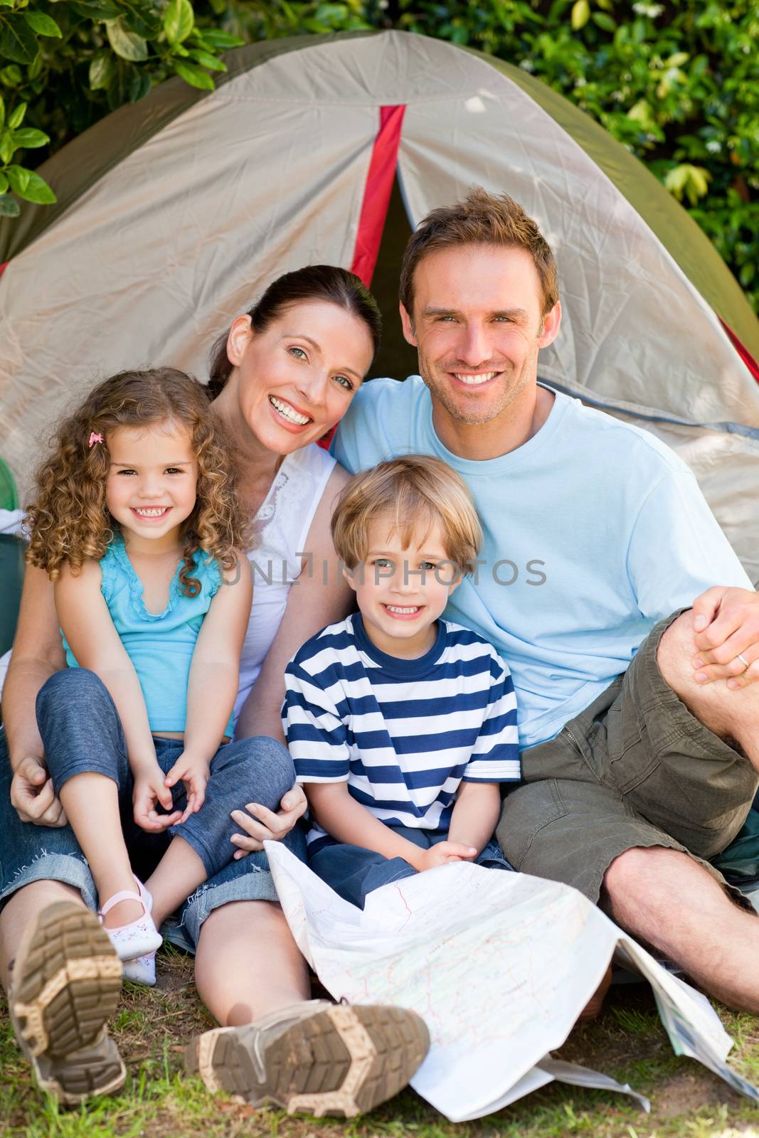 Adorable family camping in the garden by Wavebreakmedia