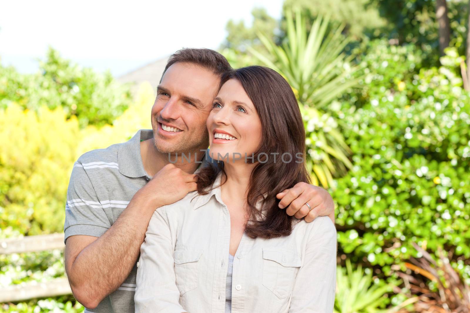 Beautiful woman with her husband in the garden